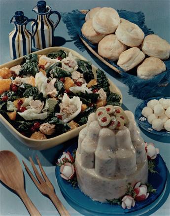 (FOOD) Group of 25 vivid color photographs of mid-20th-century table spreads and themed meals.